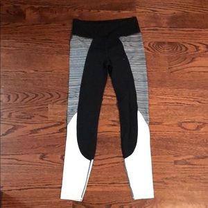 Athleta black leggings with white and gray panels
